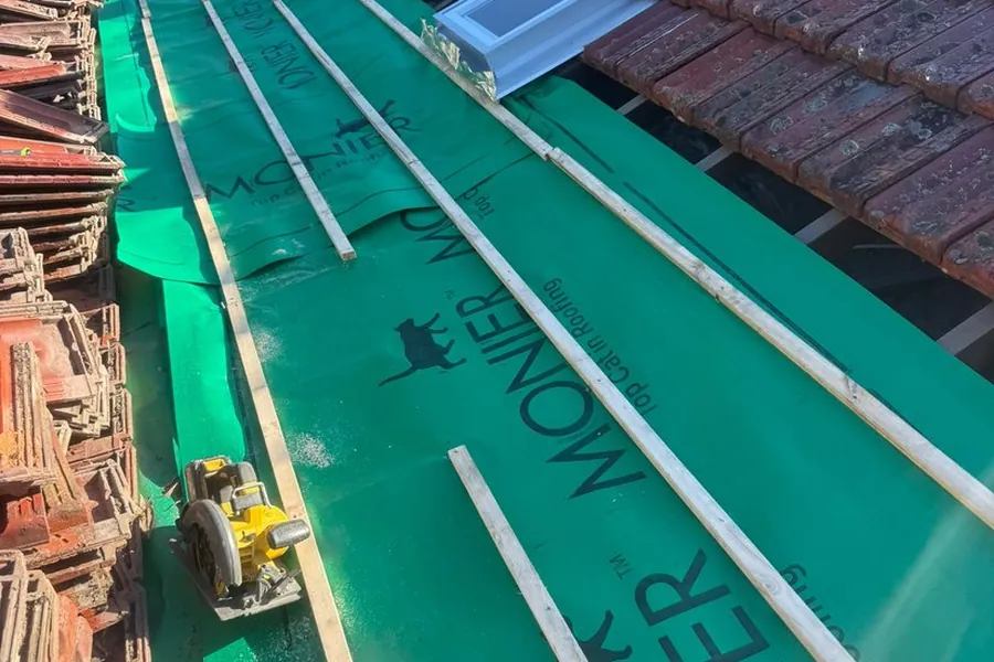New waterproof sarking and new timber battens fitted under the tiles