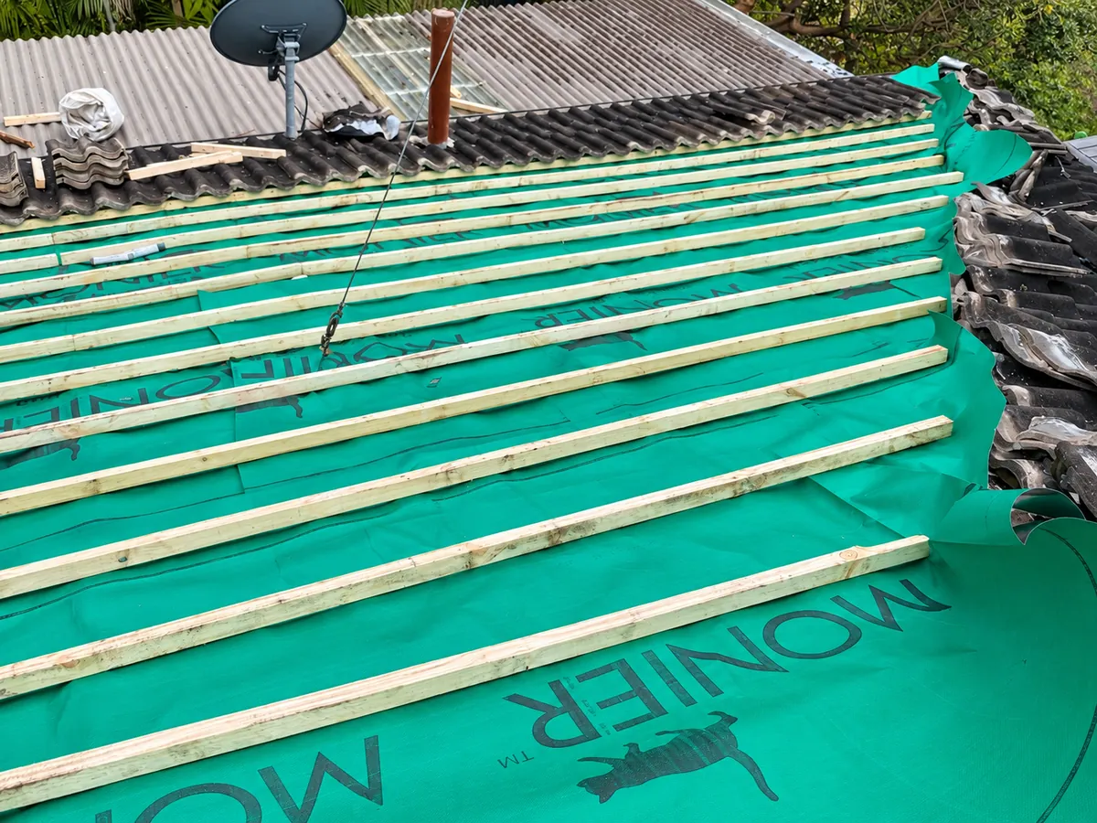 Roof section stripped back and fitted with new sarking and new timber battens before retiling